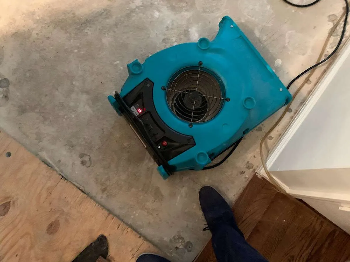 Air mover drying subfloor during Leak Detection & Repair in Airway Heights